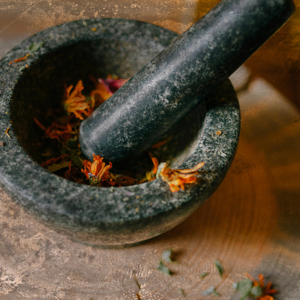 Image of flowers in a mortar and pestle